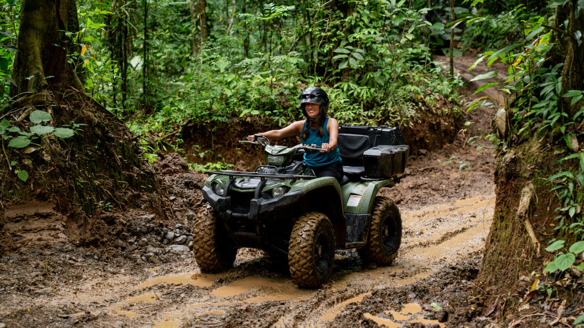 ATV rider on a forest trail at Vista Los Sueños, Herradura