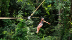 Canopy zipline rider at Vista Los Sueños Adventure Park