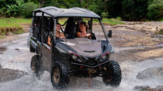 Buggy crossing the river at Vista Los Sueños, Herradura