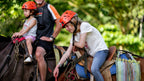 Horseback riders with a guide at Vista Los Sueños, Herradura
