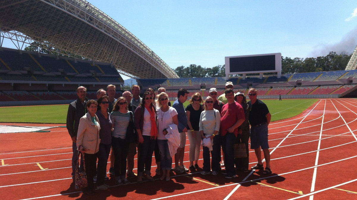 VIP City Bus tour group visiting the National Stadium in San José