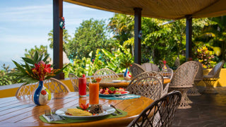 Breakfast table on the restaurant terrace at Xandari Resort