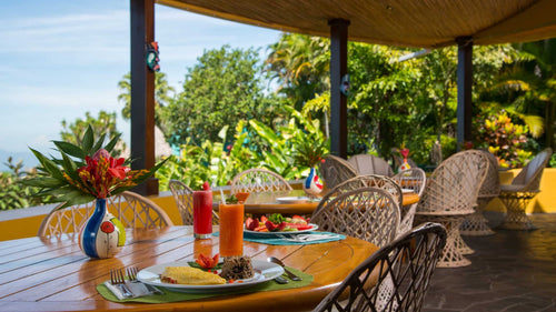 Breakfast table on the restaurant terrace at Xandari Resort